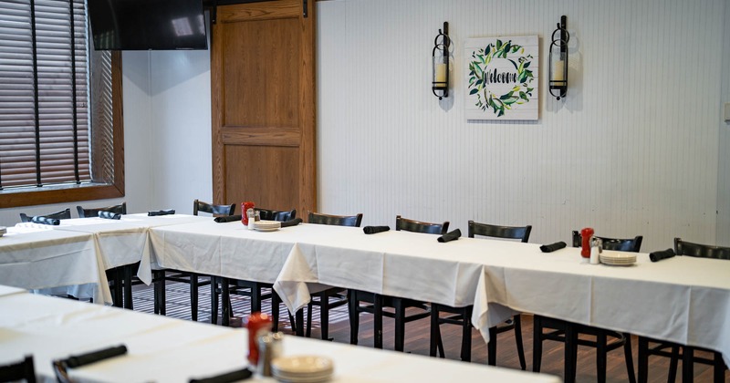 Interior, dining area, tables and chairs with booths in the back