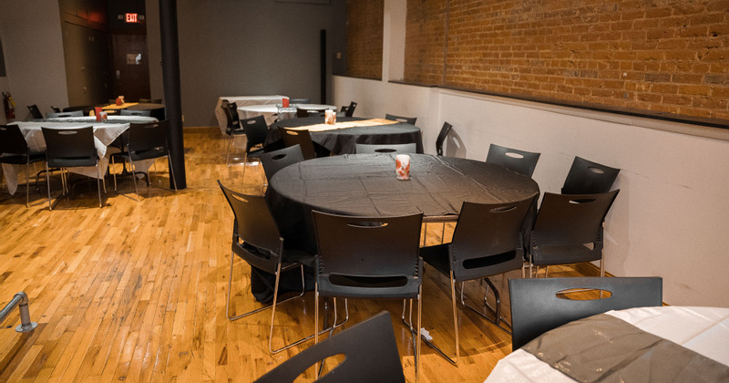 Interior, dining room with round tables and chairs