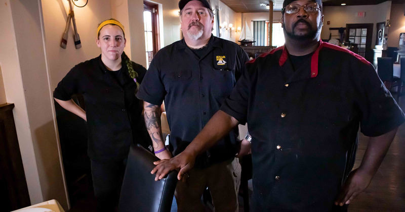 Photo of three staff members