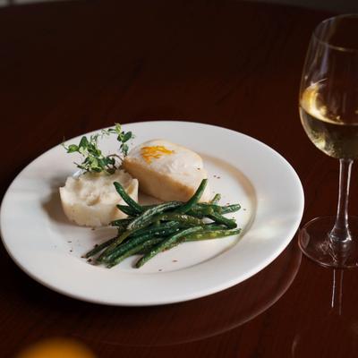 Chilean sea bass, with mashed potatoes, green beans, and white wine.