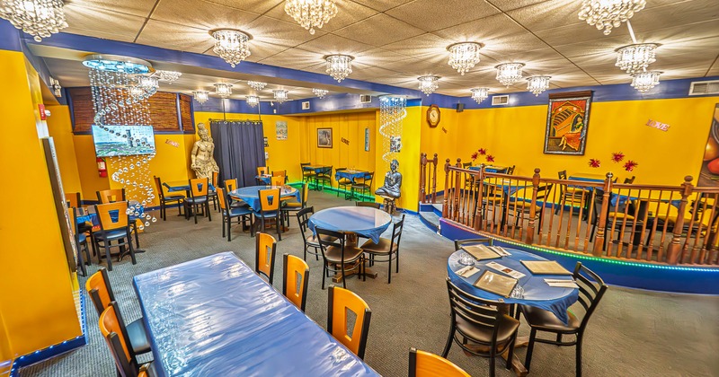 Spacious, colorful and cozy restaurant interior in Indian style