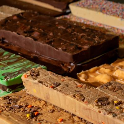 Assorted fudge varieties in a display case.