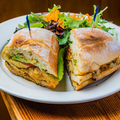 Grilled chicken sandwich with mixed green salad.