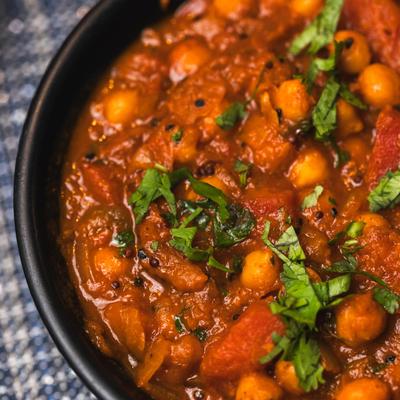 Red pumpkin dish, with chickpeas, and mustard seeds.