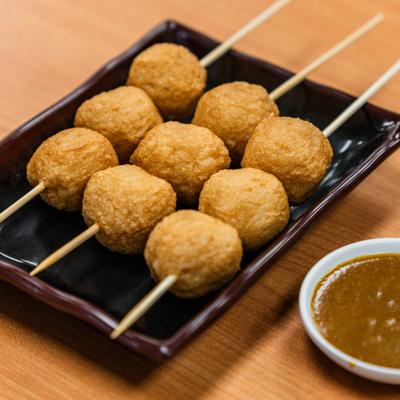Fried fish balls with dipping sauce.