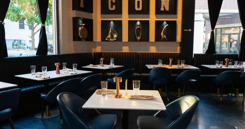 Modern and stylish restaurant interior dining area with tables set for guests