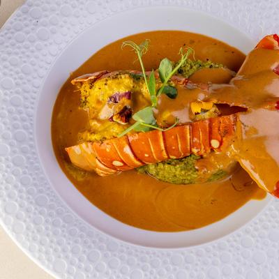 Lobster marinated in fennel, mustard and curry leaves, cooked in Goan sauce.
