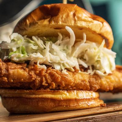 Fried Grouper sandwich, with tartar sauce, and cabbage slaw.