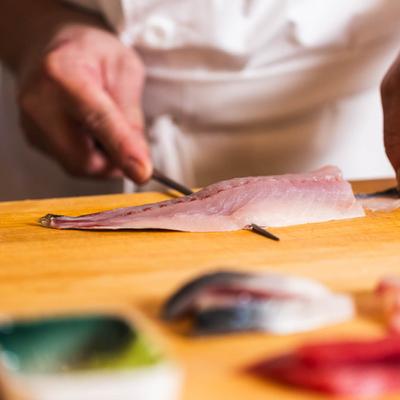 Chef slicing fish.