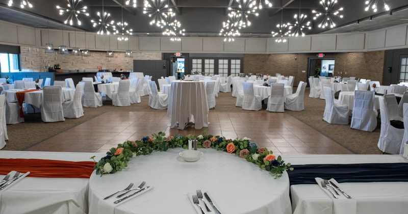 Banquet room with skirted chairs and tables