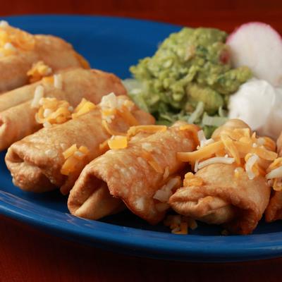 Meat filled mini chimis with sour cream & freshly made guacamole