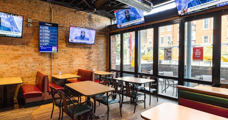 Interior, tables and chairs with view on street