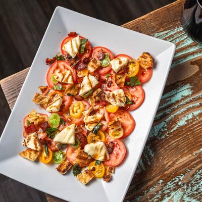 Tomatoes and bacon salad with grilled halloumi.