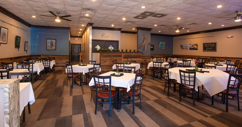 Interior, spacious dining area decorated with pictures on the wall