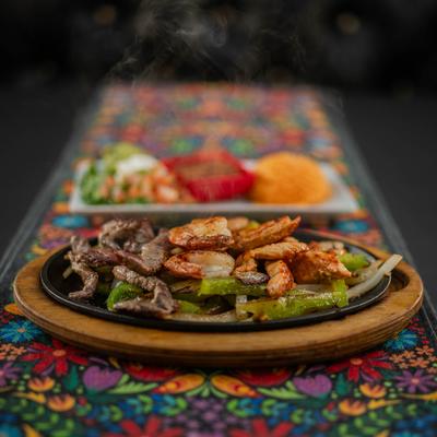 Chicken, steak, and shrimp Fajitas.