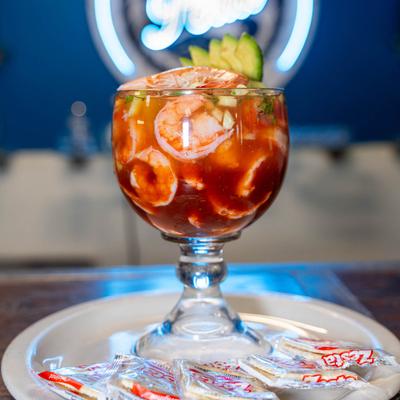 Shrimp cocktail served with crackers.