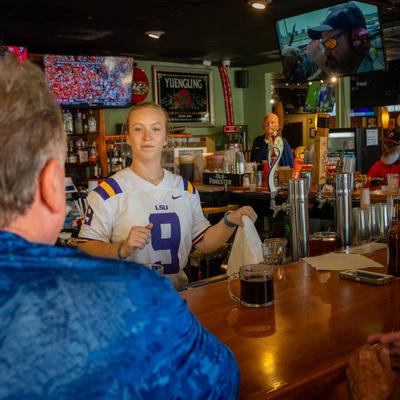 Bartender tending to a customer.