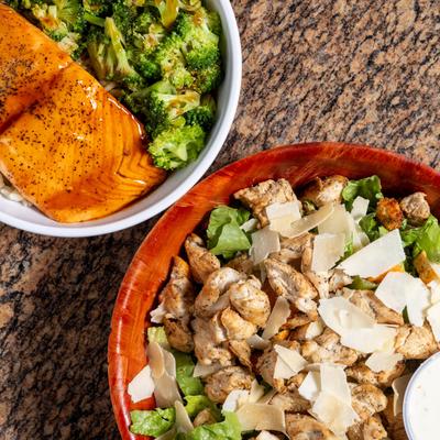 Chicken Caesar Salad and Salmon Rice Bowl.
