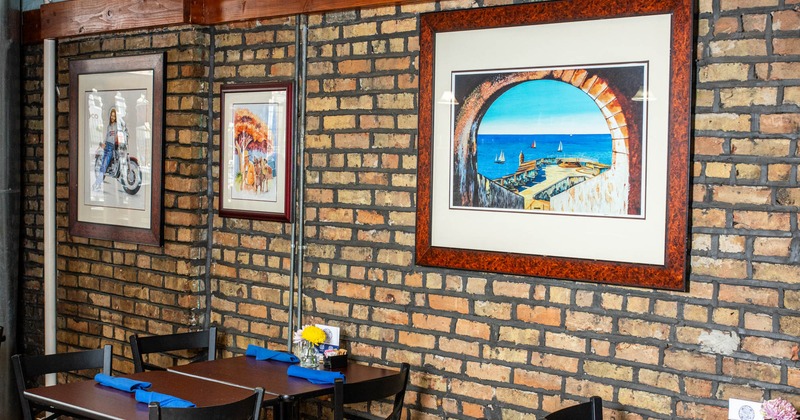 Interior, dining area with big pictures on the wall