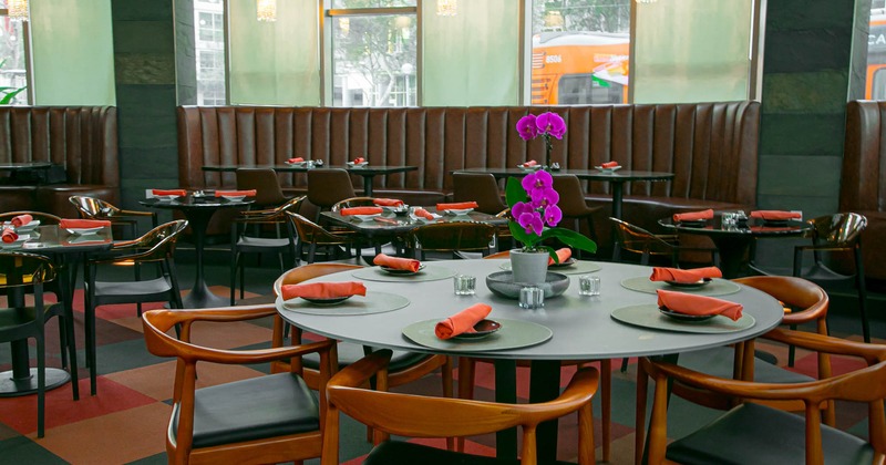 Interior, round table set and ready for guests