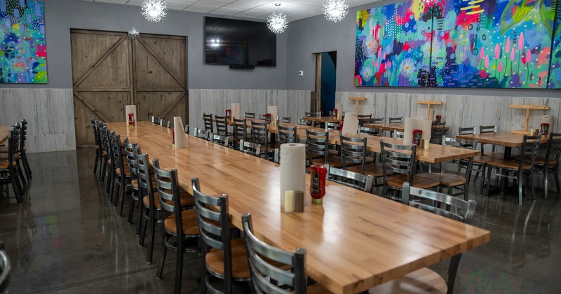 Interior, tables and chairs all lined up ready for guests