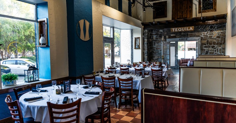 Interior, dining area, set up tables and ready for guests, checkered tile flooring