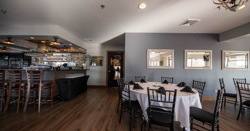 Interior, the bar is on the left, and the dining tables are on the right