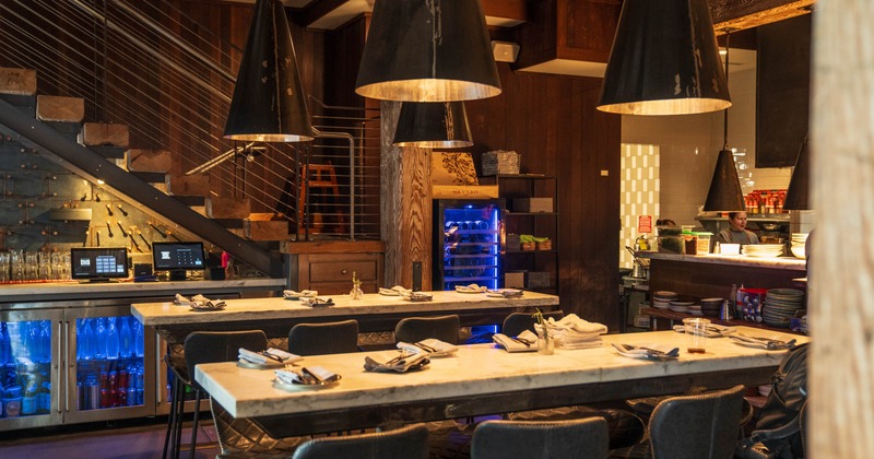 Interior, high seating area, marble top high seating tables with bar stools, ready for guests