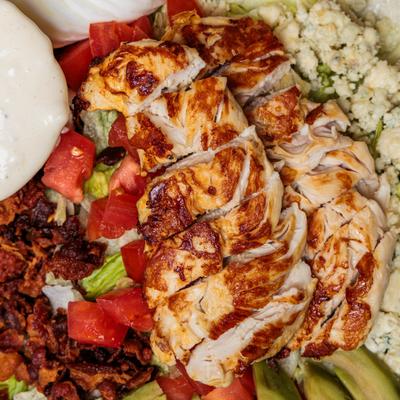 Cobb Salad with chicken, bacon, tomato, egg, avocado and bleu cheese.