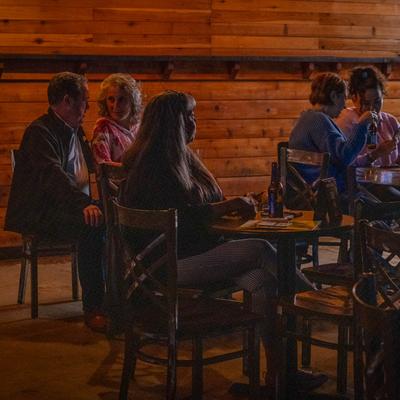 Interior, guests sitting at tables.