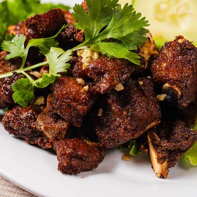 Marinated pork ribs with crispy garlic and cilantro.