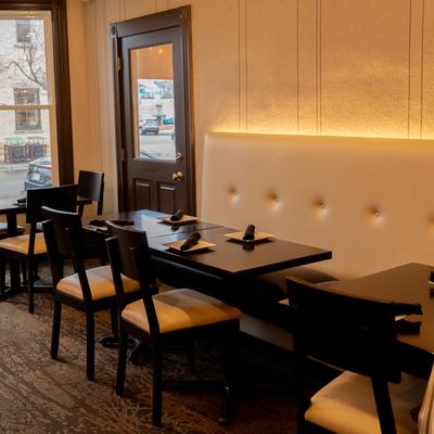 Restaurant interior, cozy dining area with set dining tables suitable for smaller private parties.