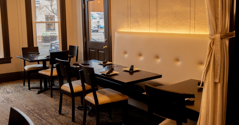 Restaurant interior, cozy dining area with set dining tables