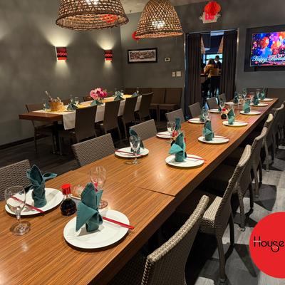 Modern dining area with neatly arranged tables for a party.