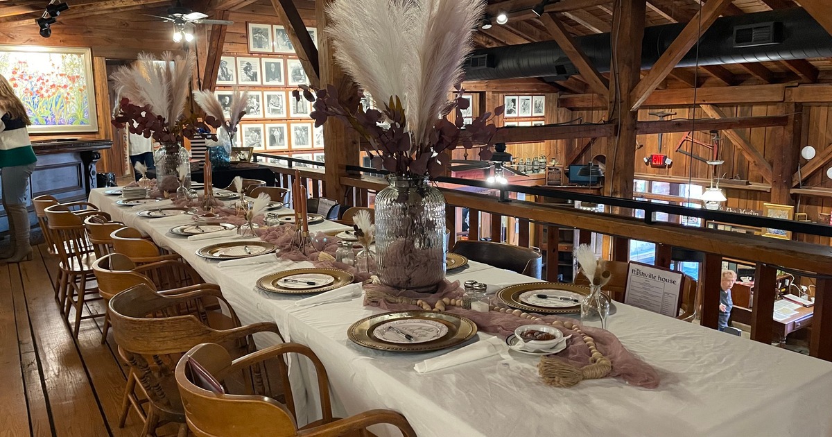 Long banquet table with pampas grass centerpieces
