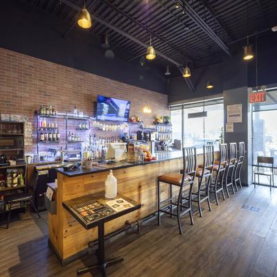 Interior, a bar with chairs.
