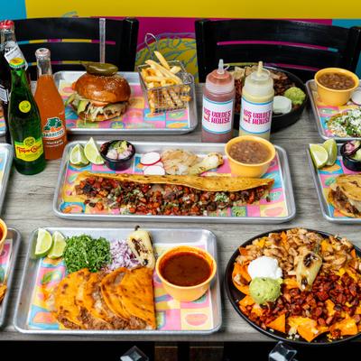 Assorted Mexican dishes arranged on table.