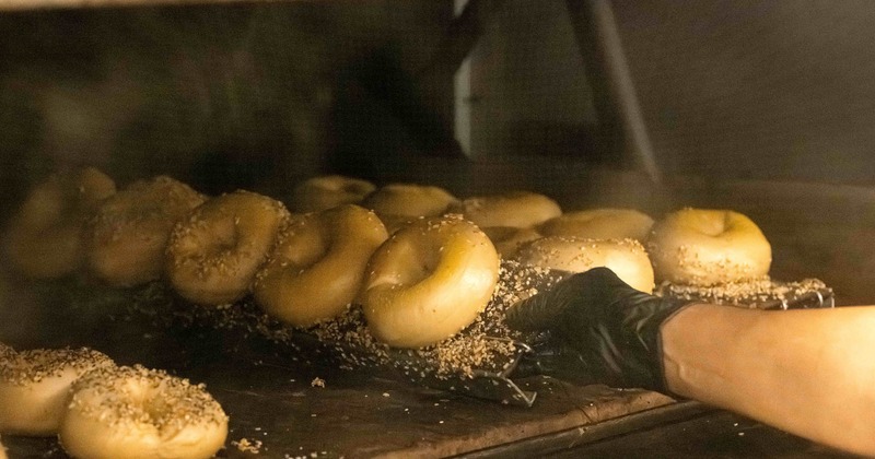 Bagels getting baked in an oven