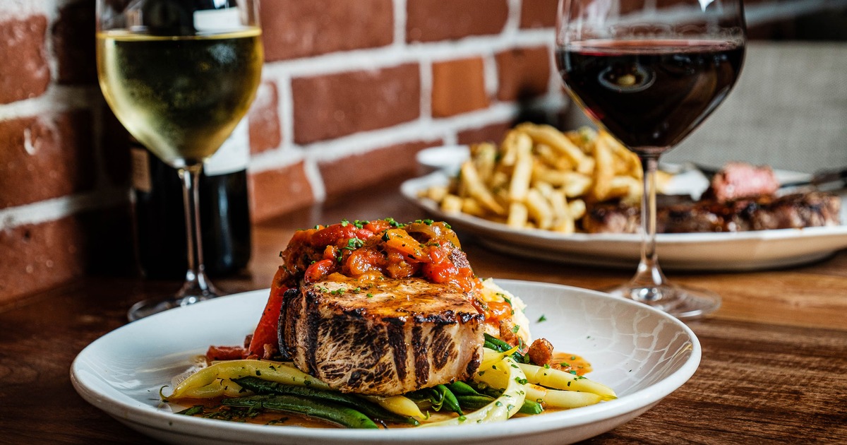 Duroc Pork Chop served with a red pepper and tasso ham basquaise