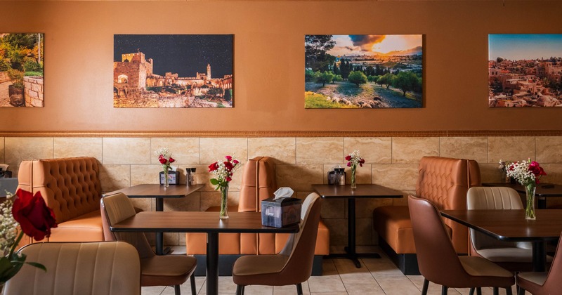 Interior, cozy dining area, tables for two, leather sheeted seating booths with tables