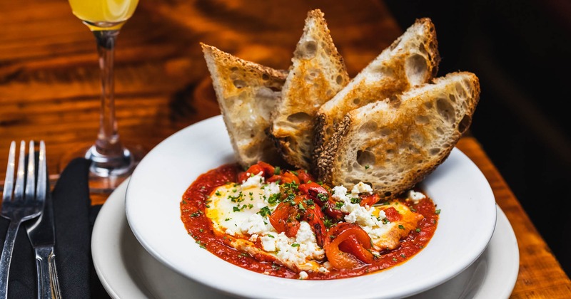 Homemade slow tomatoes with garlic and eggs