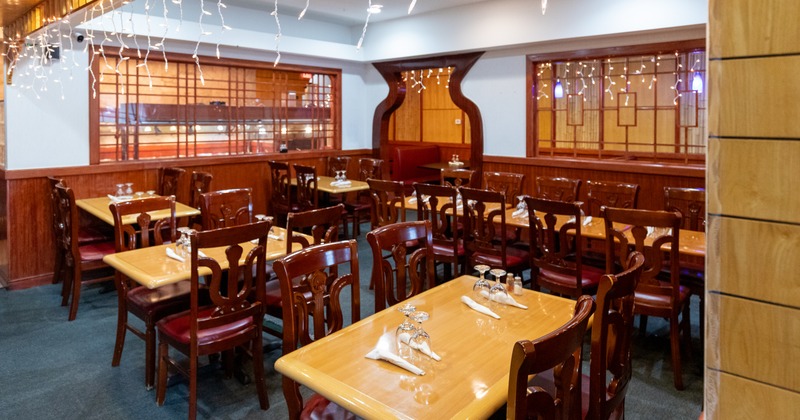 Interior, dining area with wooden tables and chairs
