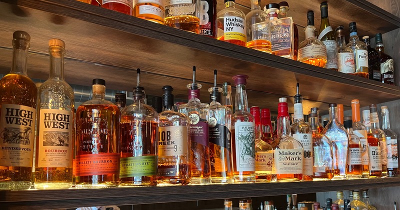 Various liquor bottles on the shelf