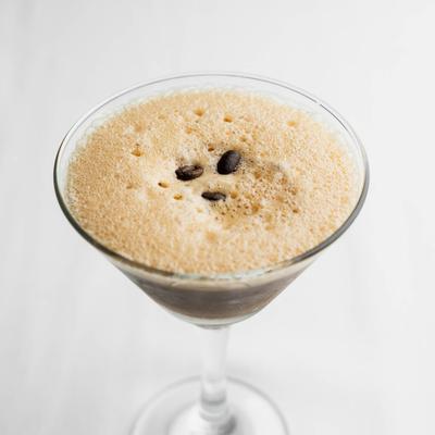 Espresso Martini garnished with coffee beans.