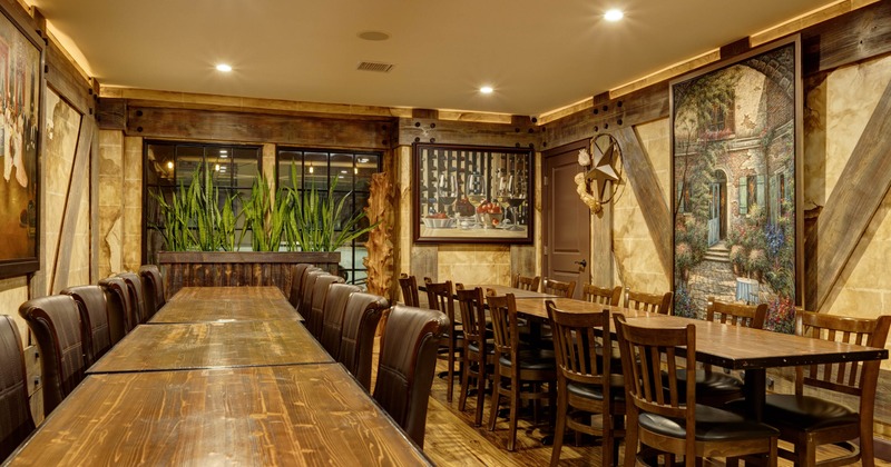 Interior, dining area, long table setups for twelve people, hardwood flooring