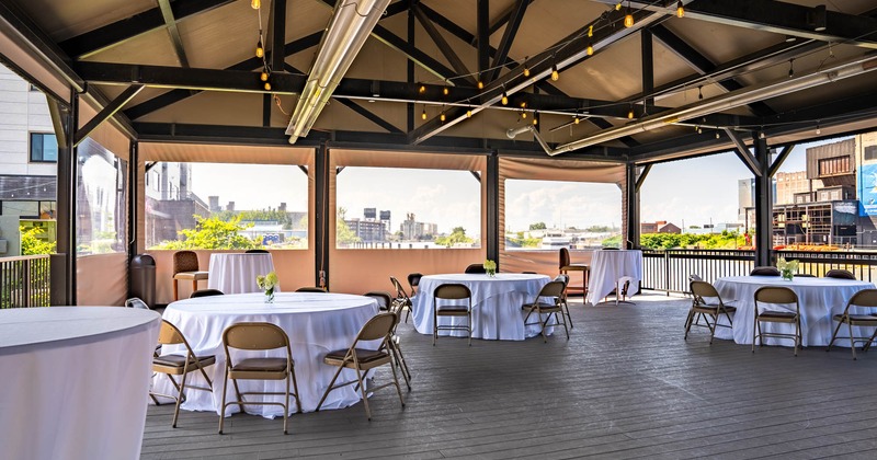 Round tables and chairs in the covered patio