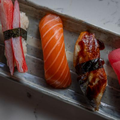 Chef plate with Assorted nigiri pieces.