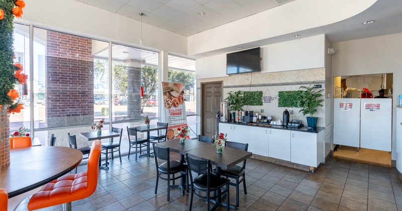 Interior, tables and chairs ready for guests