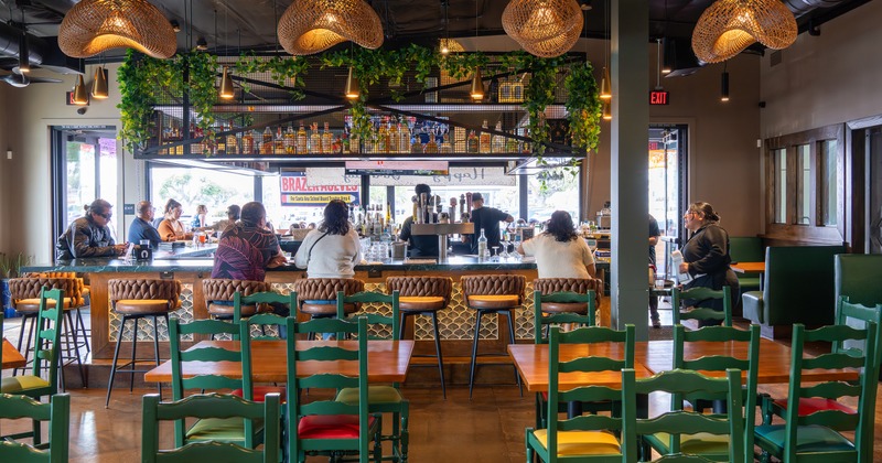 Cozy interior seating area and bar with guests