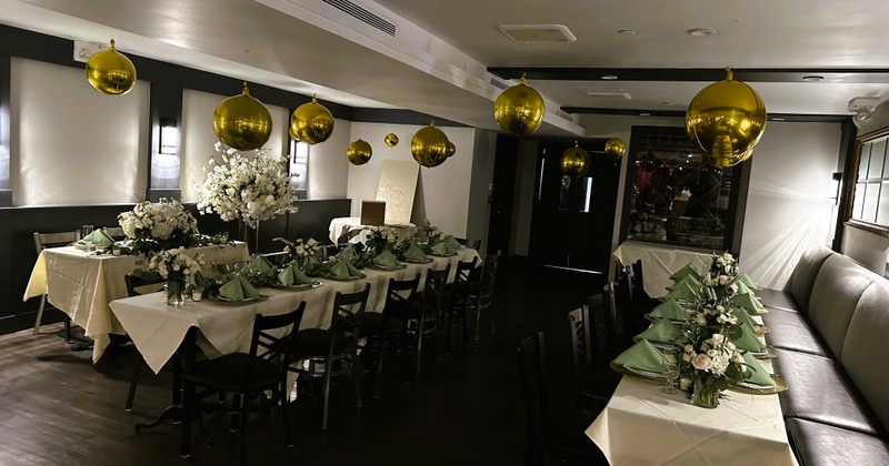 Private parties room with set dining tables and party decoration